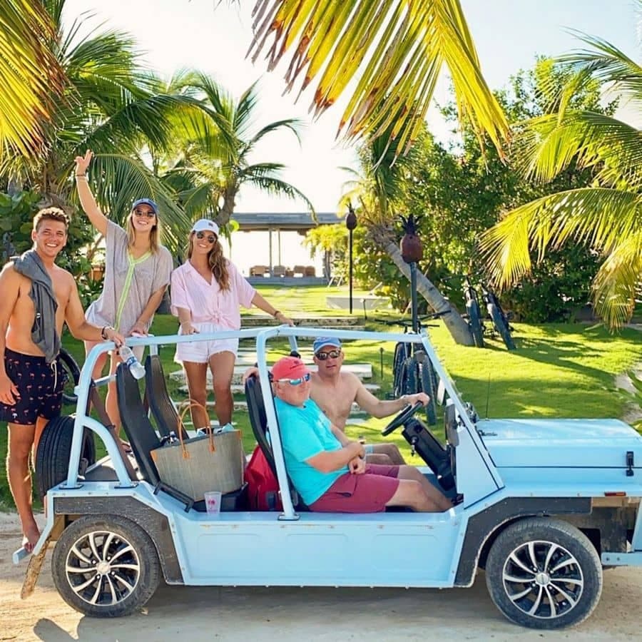 People enjoying a ride in a Moke America vehicle